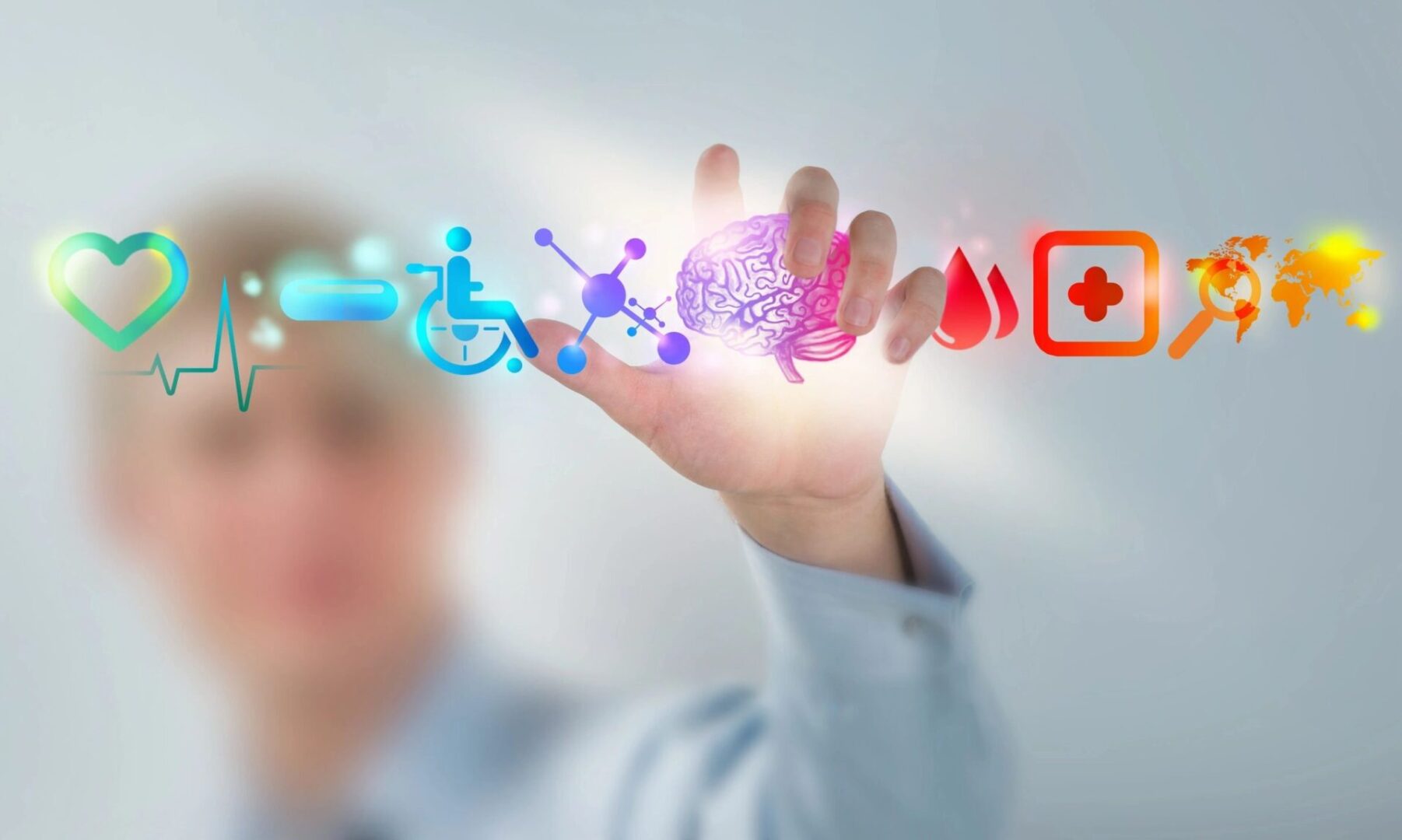 A hand with multiple images of people and a person in a wheelchair.